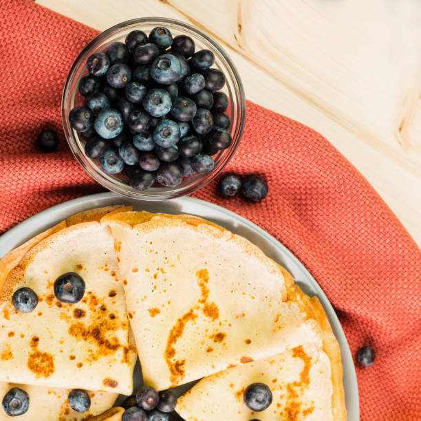 Fresh homemade crepes with blueberry and honey
