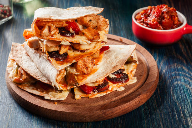istock Stack of quesadillas with chicken, sausage chorizo and red peppe 1127767131