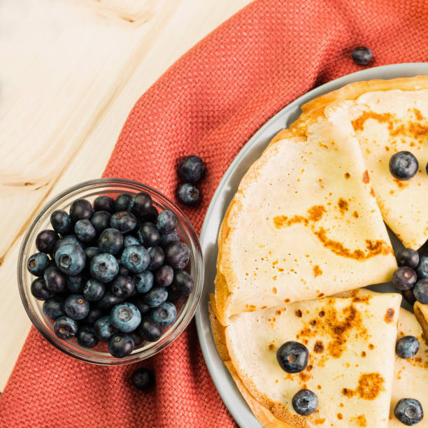 Fresh homemade crepes with blueberry and honey