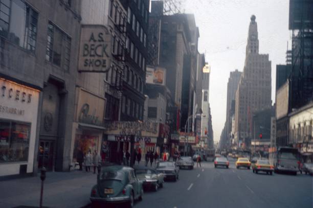 New York City, NY, USA, 1967. Broadway street scene near Times Square. Dewsweiteren: The former Metropol Cafe, cars, shops, advertising, traffic, buildings and pedestrians.