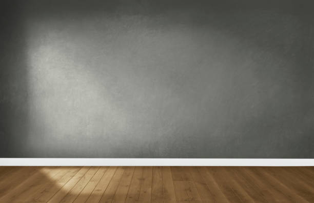 istock Gray wall in an empty room with a wooden floor 1127767937