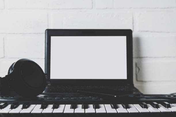 istock Synthesizer and laptop. The concept of a home Studio or recording 1127768967