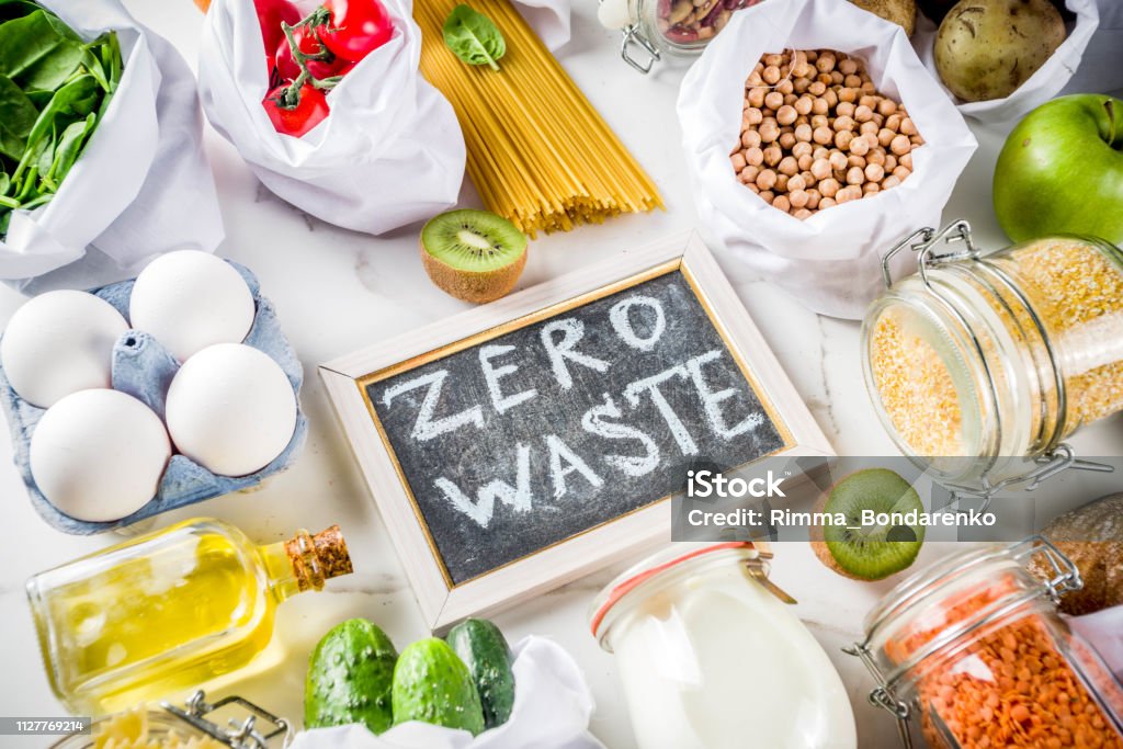 Zero waste shopping concept Zero waste shopping and sustanable lifestyle concept, various farm organic vegetables, grains, pasta, eggs and fruits in reusable packaging supermarket bags. copy space top view, white concrete table Food Stock Photo