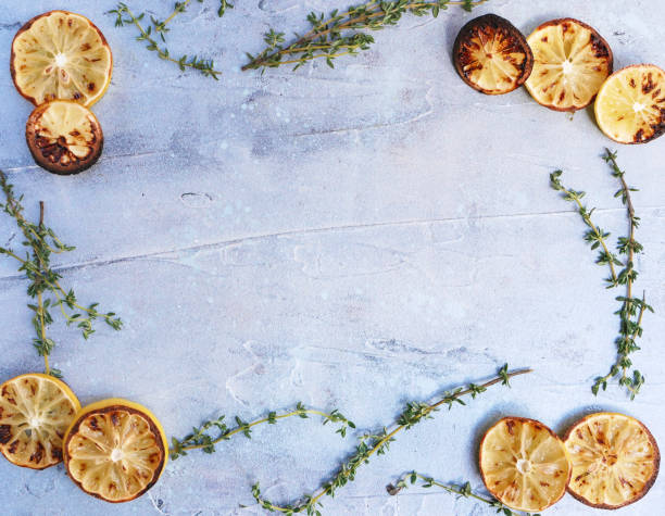 Roasted lemon and thyme food border, image frame flaylay