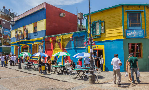 People on the the streets of La Boca in Buenos Aires Buenos Aires, Argentina - November 4, 2012: People on the the colorful streets of La Boca neighborhood in Buenos Aires, Argentina la boca stock pictures, royalty-free photos & images
