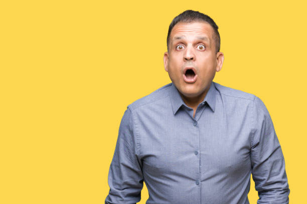 istock Middle age arab business man over isolated background afraid and shocked with surprise expression, fear and excited face. 1127776331