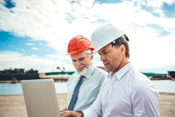 istock Inspectors At Commercial Dock 1127776547