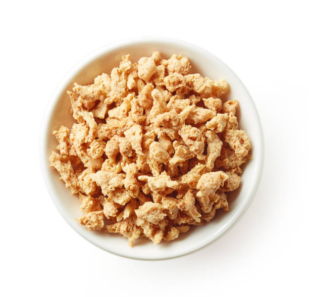 istock Bowl of soya chunks isolated on white, from above 1127776999