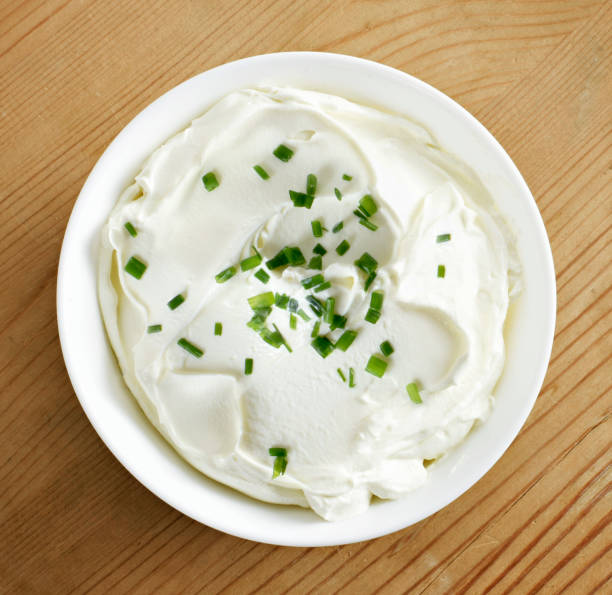 istock Cream cheese, quark or yogurt in a white bowl 1127778383