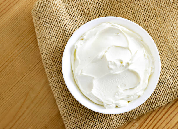istock Cream cheese, quark or yogurt in a white bowl 1127778389