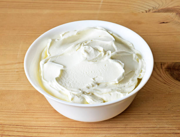 istock Cream cheese, quark or yogurt in a white bowl 1127778448