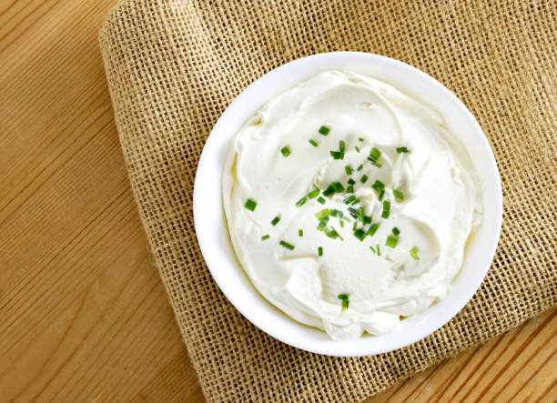 istock Cream cheese, quark or yogurt in a white bowl 1127778462