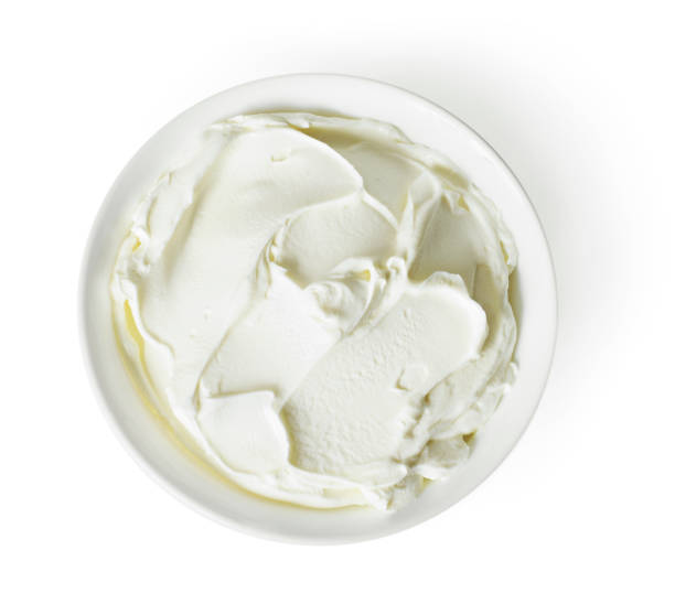 istock Cream cheese, quark or yogurt in a white bowl 1127778548