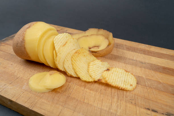 istock Potatoes isolated on wooden table 1127779842