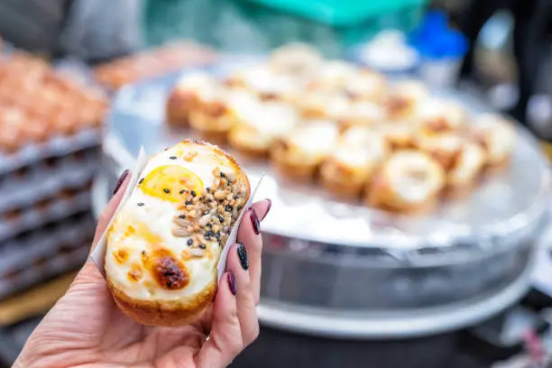 Photo of Egg bread with almond, peanut and sunflower seed at Myeong-dong street food, Seoul, South Korea