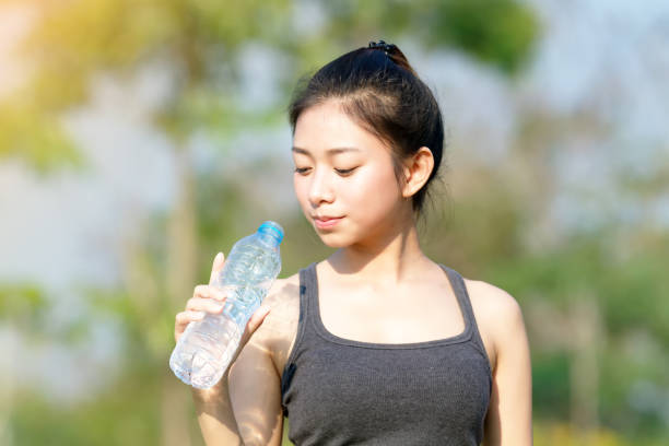 istock Woman Drinking Water From Bottle 1127781245