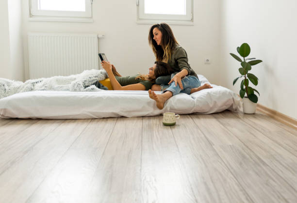 istock Lesbian couple lying in bed having fun 1127781886