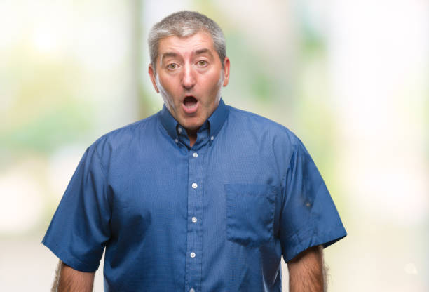 istock Handsome senior man over isolated background afraid and shocked with surprise expression, fear and excited face. 1127786497