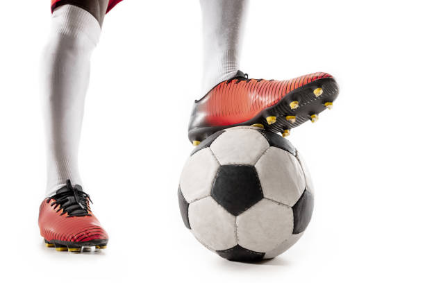 istock legs of soccer player close-up isolated on white 1127789270