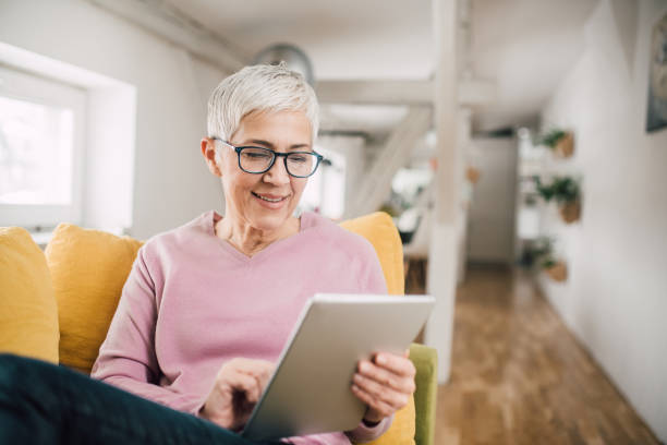 istock Woman looking at digital tablet 1127790668