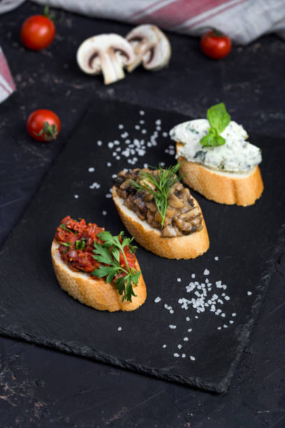 istock Mix Bruschetta with tomatoes, mushrooms and cheese 1127791120