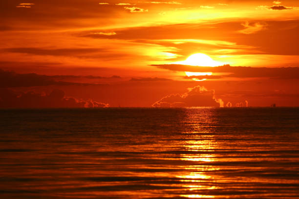 istock sun dawn back on morning sky silhouette cloud 1127791656