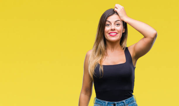 istock Young beautiful woman over isolated background confuse and wonder about question. Uncertain with doubt, thinking with hand on head. Pensive concept. 1127792806