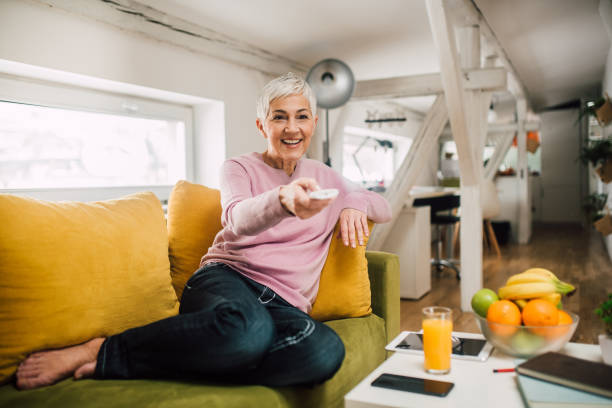 istock Woman watching TV 1127793638