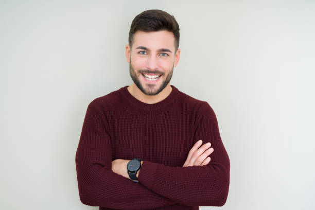istock Young handsome man wearing a sweater over isolated background happy face smiling with crossed arms looking at the camera. Positive person. 1127793676