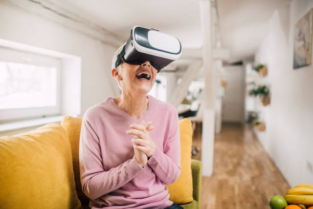 istock Happy woman with virtual reality 1127793860