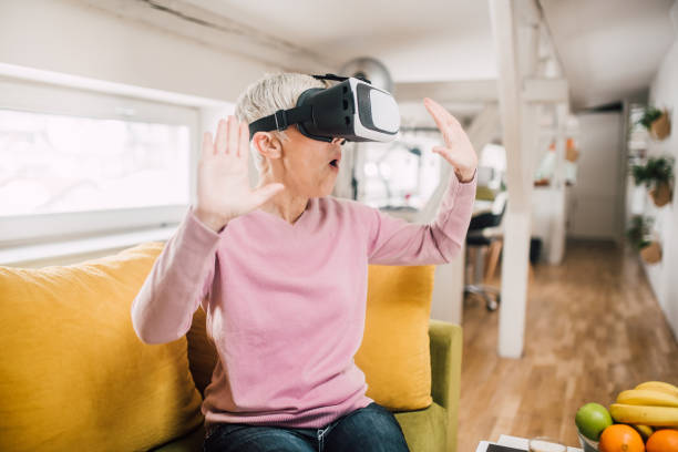 istock Woman with virtual reality glasses 1127793943