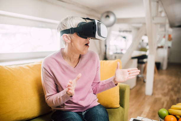 istock Mature woman with 3D simulator 1127793989