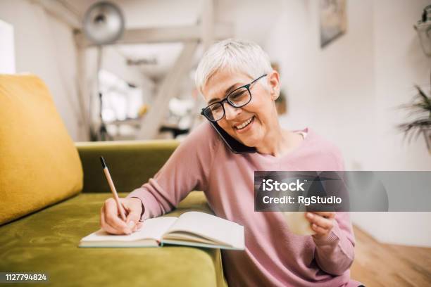 Happy Woman Talking On Phone Stock Photo - Download Image Now - Using Phone, Senior Adult, Women
