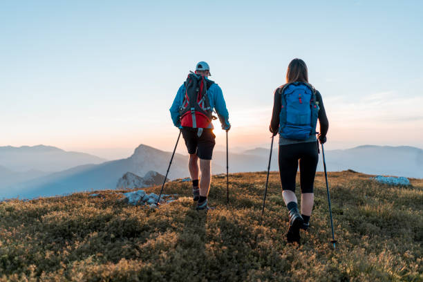 istock Young man and woman backpacking in the nature 1127795036