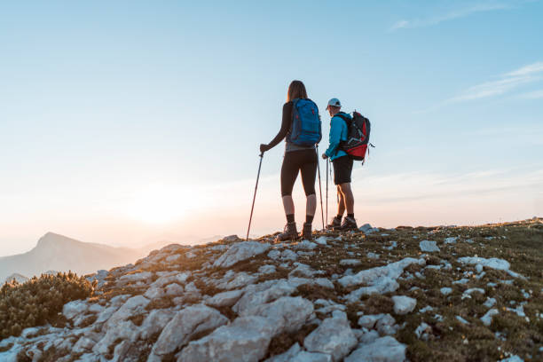 istock Young couple looking at the sunrise 1127796579