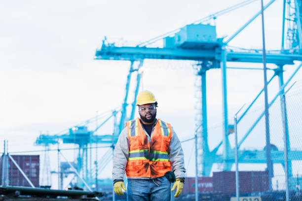 istock African-American dock worker at shipping port 1127798378