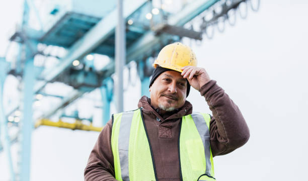 istock Hispanic dock worker at shipping port 1127798684