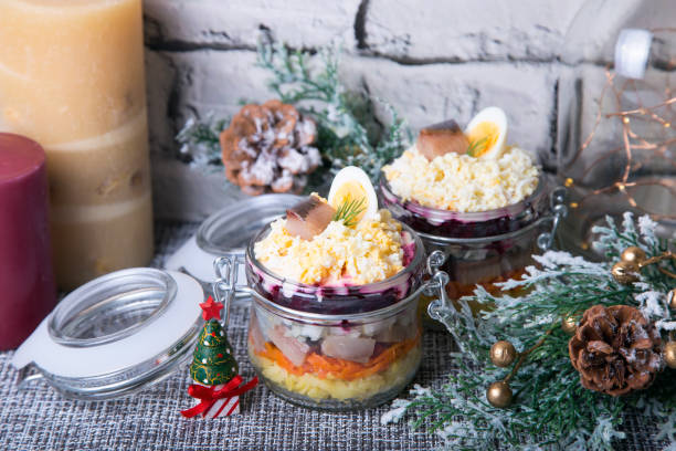 istock Herring under a fur coat. Traditional Russian multi-layered salad of herring, beetroot, potatoes, carrots and eggs. 1127798688