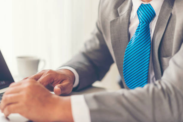 istock Midsection Of Businessman Wearing Suit Working In Office 1127799157