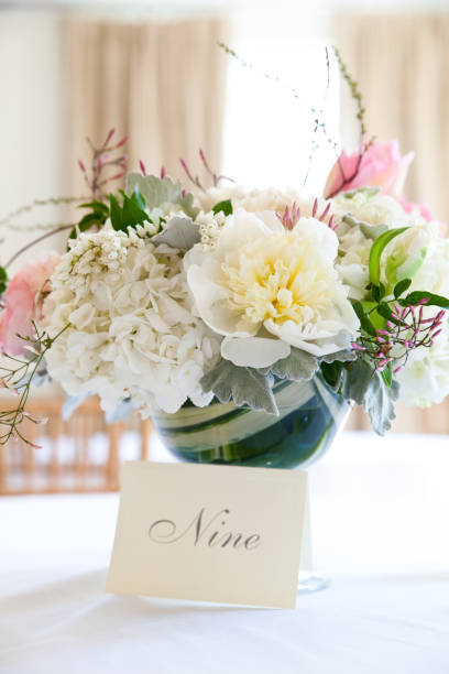 istock Pink and white bouquet of flowers on a table during a wedding celebration 1127805397