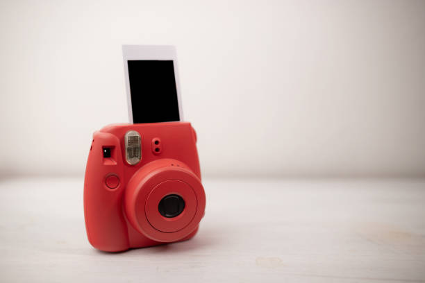 istock Polaroid Instant Camera & blank Film analog 1127805764