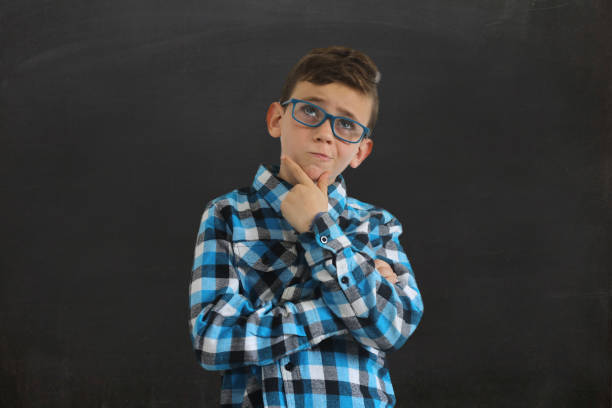 istock Young boy child think decision choice idea blackboard isolated 1127805865