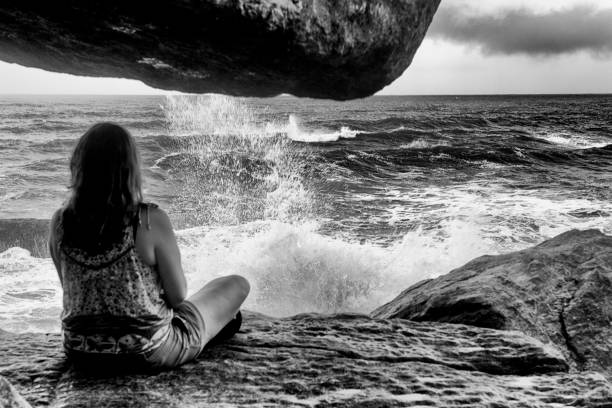 istock Woman Looking at a Storm 1127807273