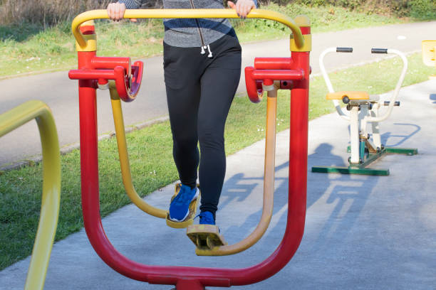 istock Young woman training with exercise equipment in a public park. 1127807466