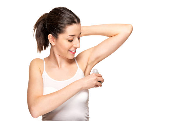 istock Beautiful woman applying roll-on deodorant 1127807611