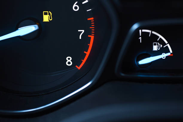 istock Display devices on the car panel show that the fuel in the tank is running low 1127807937