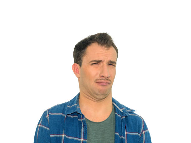 istock Portrait disgusted young man. Negative human emotion.  Isolated on a white background. 1127809408