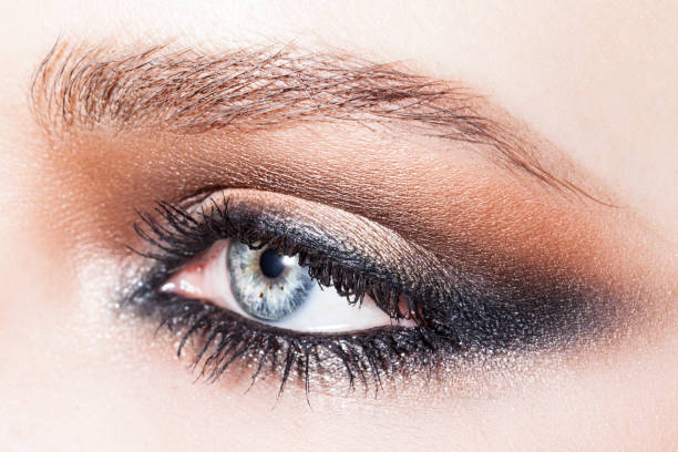 blue woman eye with smoky eyes make up