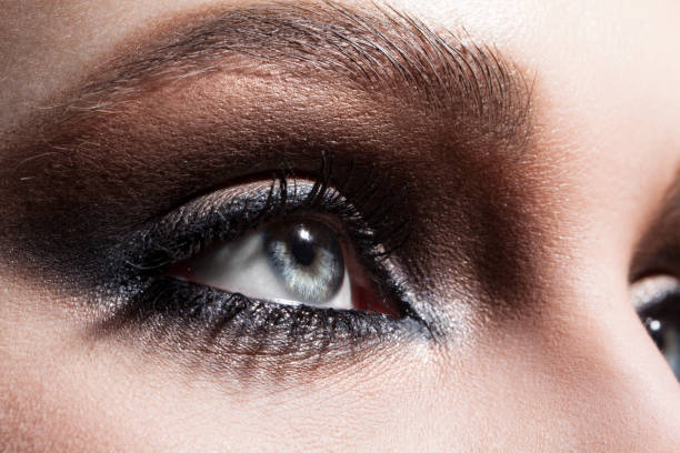 istock Close up macro beauty eyes with professional make up 1127809617