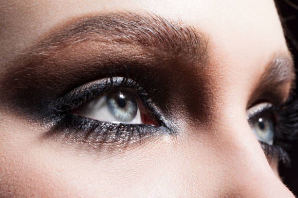 istock Close up macro beauty eyes with professional make up 1127809640